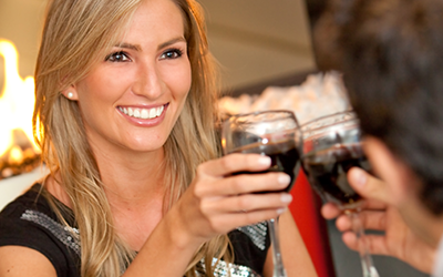 Attractive woman smilling toasting with wine