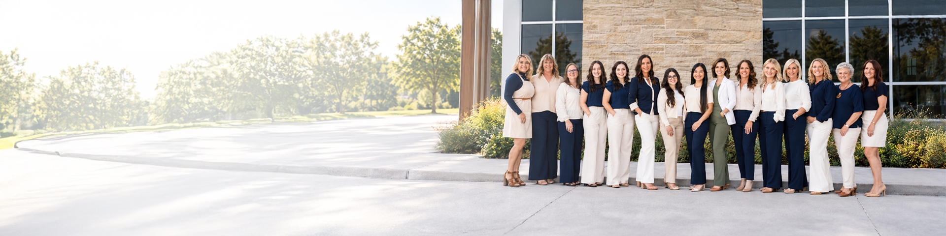 The Auburn Family Dental team standing together outside the dental office in Wichita, Kansas