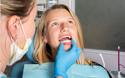 Dentist looking at teeth