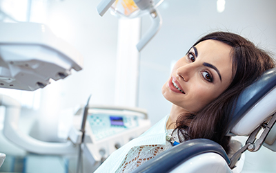 A woman sitting in a dental chair