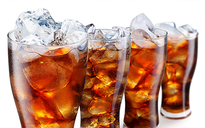 Glasses with cola and ice cubes